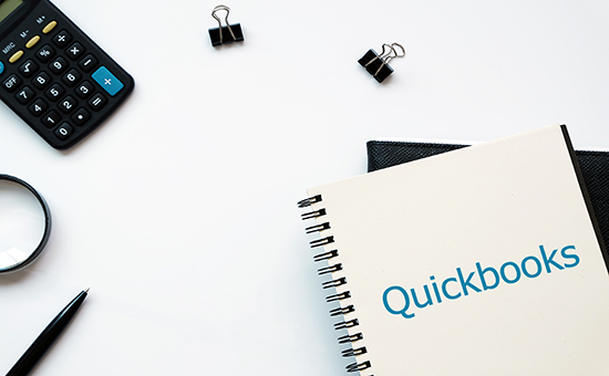 Quickbooks notebook and calculator